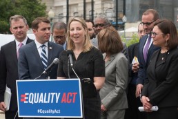 A woman speaking at a news conference about the Equality Act in 2019.